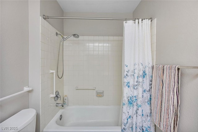 bathroom with shower / bath combination with curtain and toilet