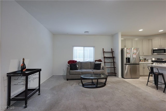 living room featuring light colored carpet