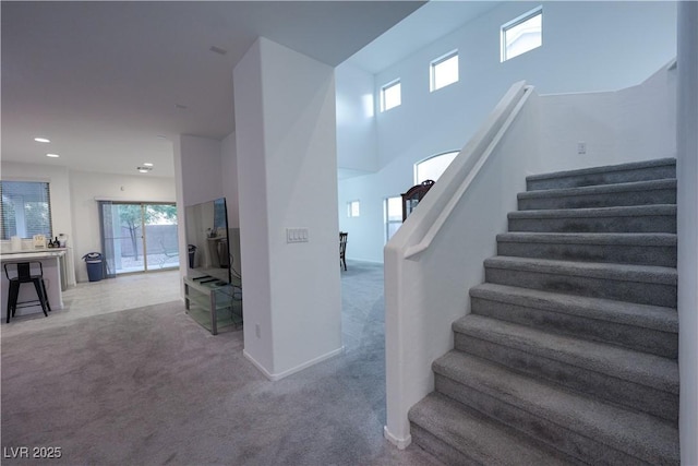 staircase with carpet floors