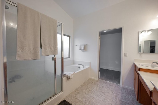 bathroom featuring vanity, separate shower and tub, and vaulted ceiling