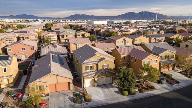 birds eye view of property featuring a mountain view