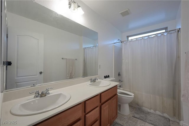 full bathroom featuring vanity, shower / bath combination with curtain, and toilet