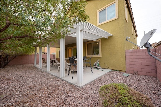 back of house featuring a patio area and a pergola