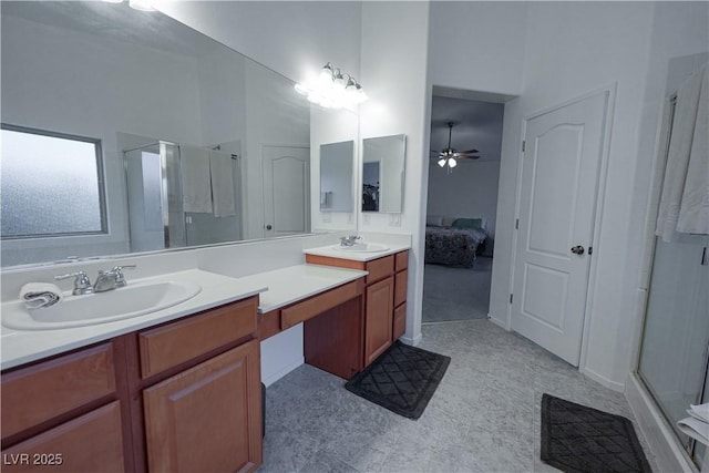 bathroom featuring ceiling fan, a shower with door, and vanity