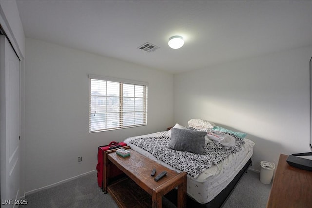 carpeted bedroom with a closet