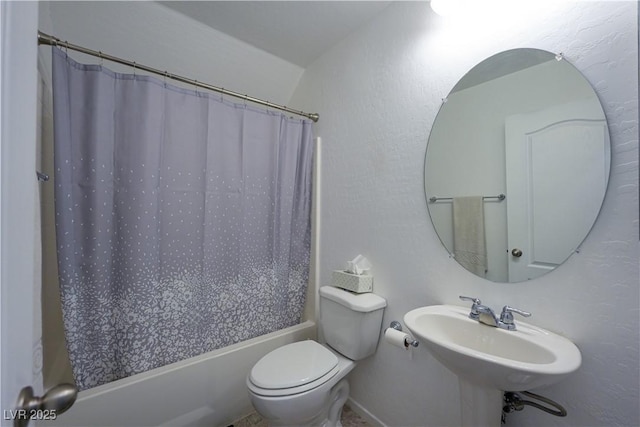 full bathroom with shower / bath combo with shower curtain, sink, and toilet