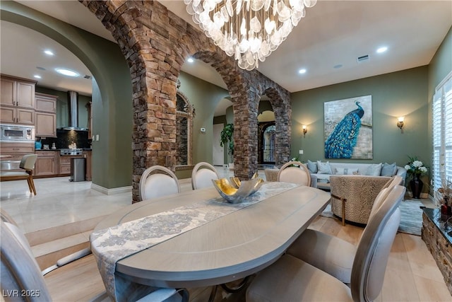 dining area featuring a notable chandelier