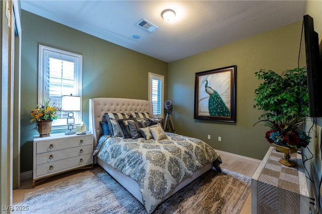 bedroom featuring light hardwood / wood-style flooring