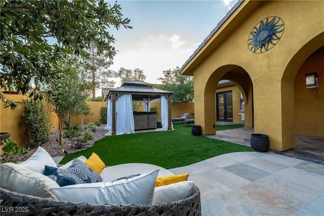 view of yard with a gazebo, french doors, a patio, and an outdoor hangout area