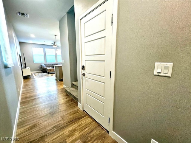 hall with light wood-type flooring