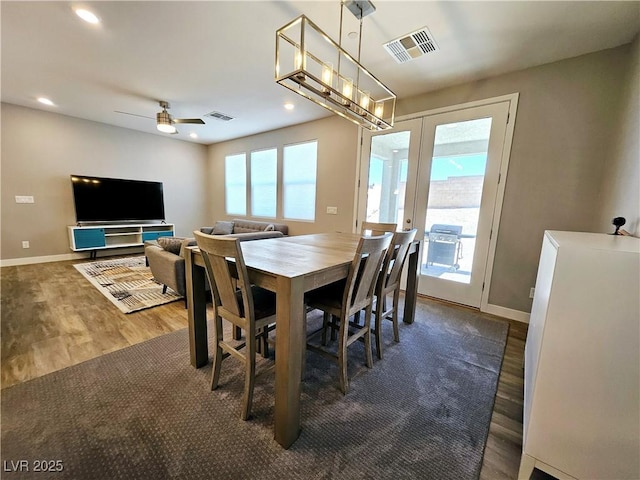 dining space featuring ceiling fan, dark hardwood / wood-style flooring, plenty of natural light, and french doors