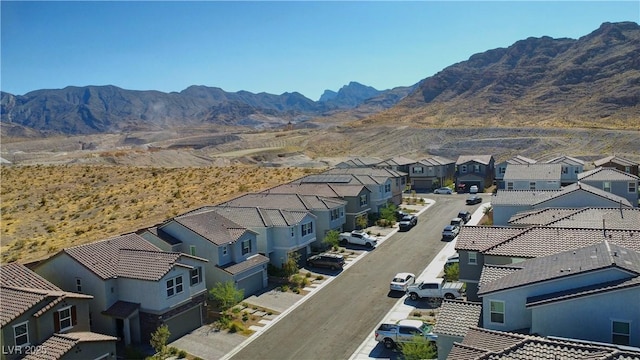 birds eye view of property featuring a mountain view