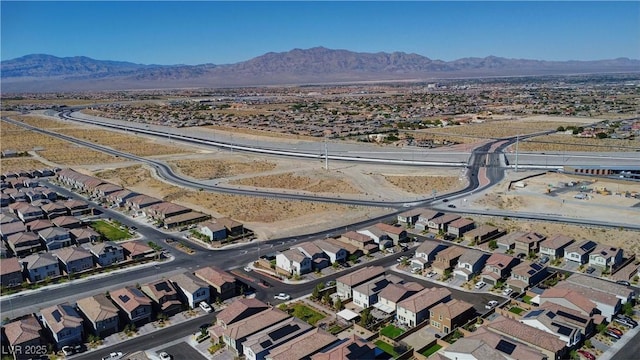 birds eye view of property with a mountain view