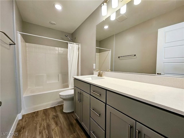 full bathroom with wood-type flooring, vanity, toilet, and shower / bathtub combination with curtain