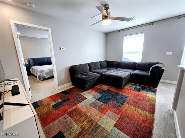 living room with carpet and ceiling fan