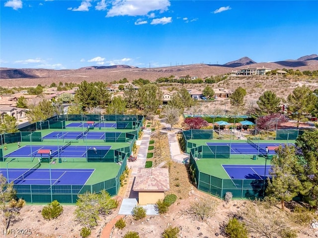 birds eye view of property with a mountain view