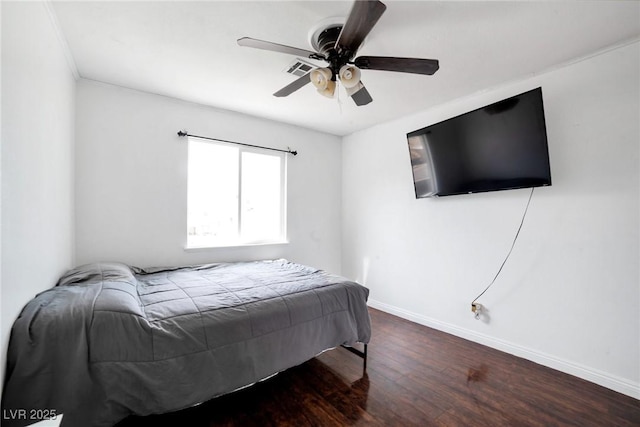 bedroom featuring ceiling fan and dark hardwood / wood-style flooring