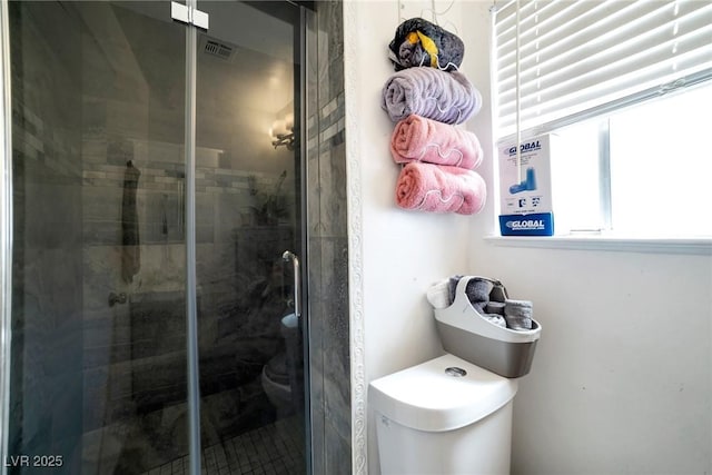 bathroom featuring an enclosed shower