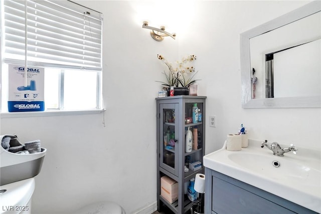 bathroom with vanity and toilet