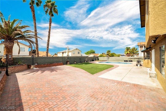 view of patio with a fenced in pool