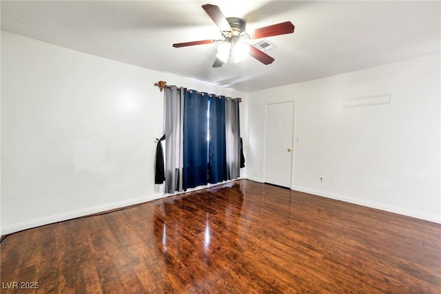 unfurnished room featuring ceiling fan and dark hardwood / wood-style flooring