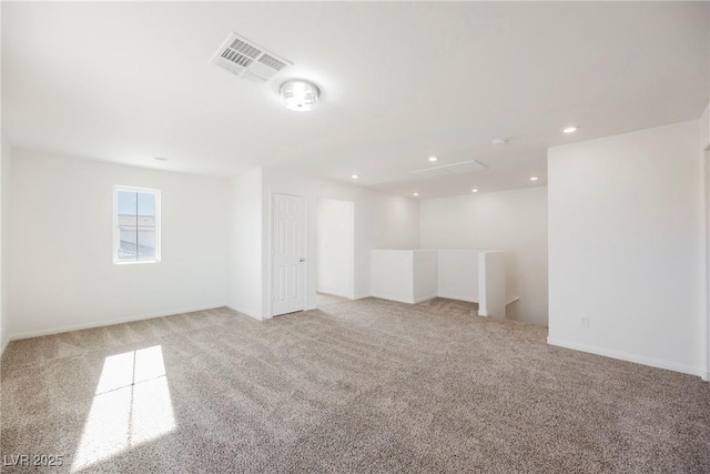 unfurnished room with light colored carpet