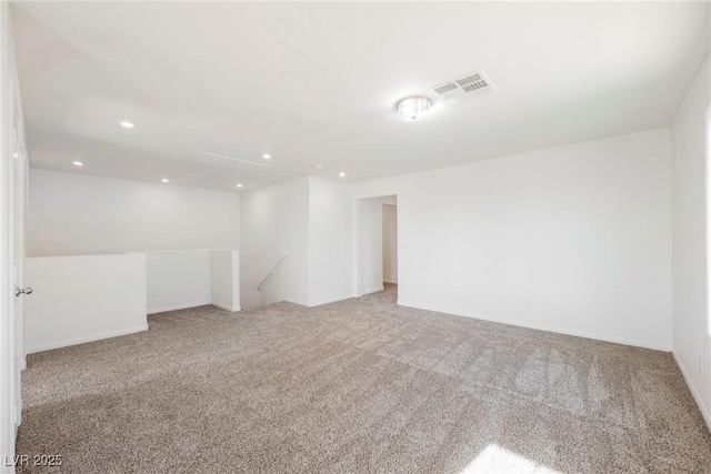 spare room featuring light colored carpet