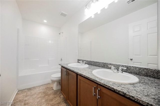 full bathroom with vanity, tub / shower combination, and toilet