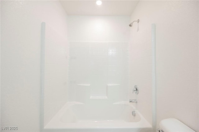 bathroom with toilet and shower / washtub combination