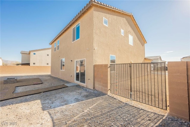 rear view of property featuring a patio area