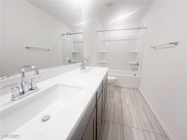 full bathroom with vanity, bathtub / shower combination, and toilet