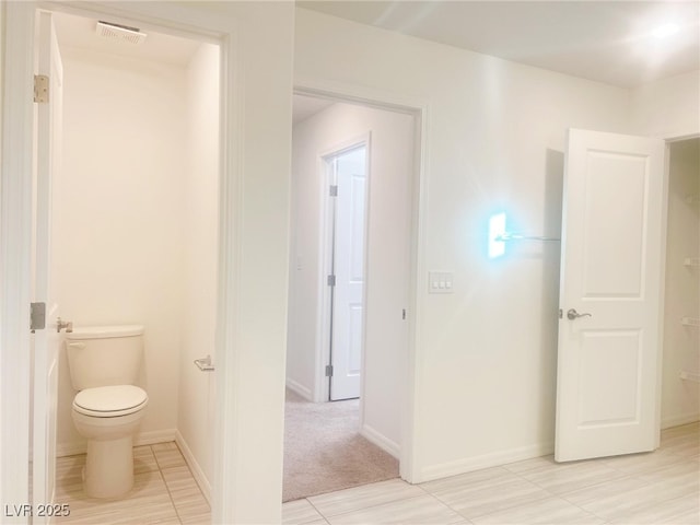 bathroom featuring toilet