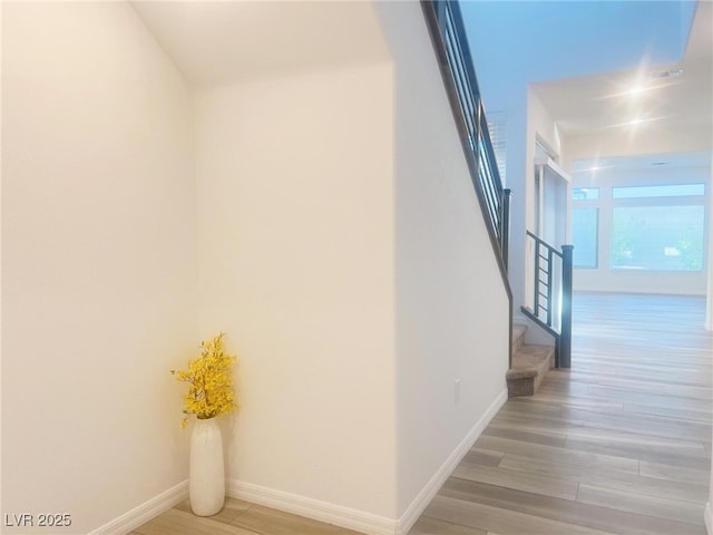 hallway with light wood-type flooring