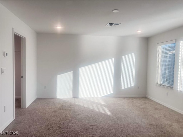 unfurnished room featuring carpet