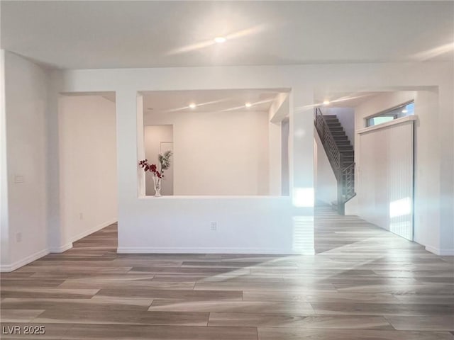 unfurnished room featuring hardwood / wood-style floors