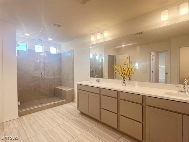 bathroom featuring vanity and a shower with door