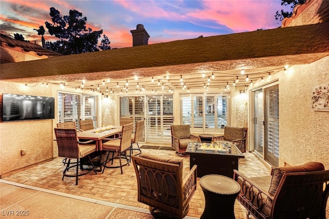 view of patio terrace at dusk