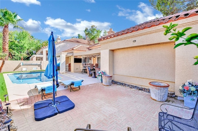 view of patio featuring a fenced in pool