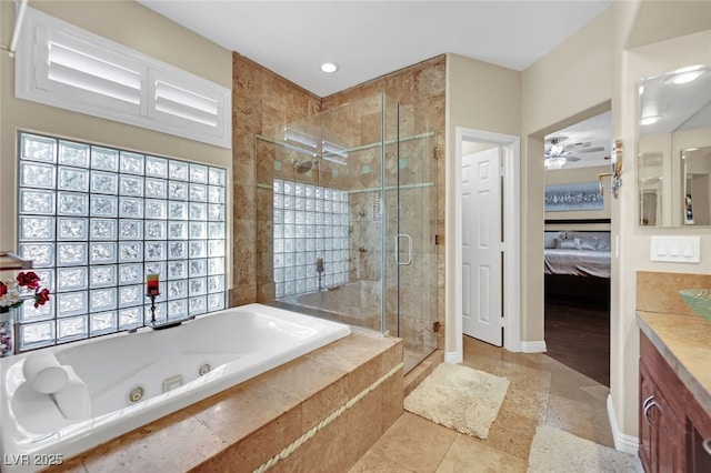 bathroom featuring ceiling fan, vanity, and shower with separate bathtub