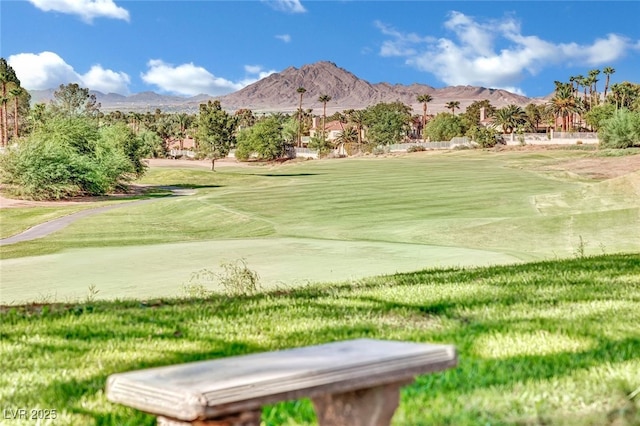 surrounding community featuring a mountain view and a yard