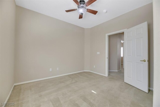 empty room with light carpet and ceiling fan