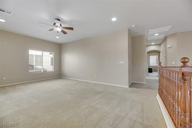 carpeted empty room with ceiling fan