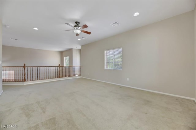 carpeted empty room with ceiling fan