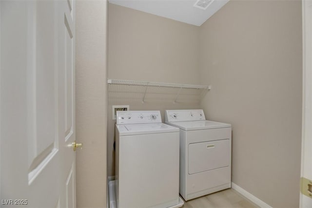 washroom featuring separate washer and dryer