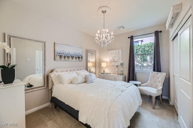 bedroom featuring carpet floors and an inviting chandelier