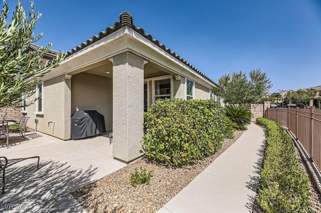 view of home's exterior with a patio area