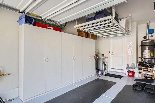 garage featuring secured water heater