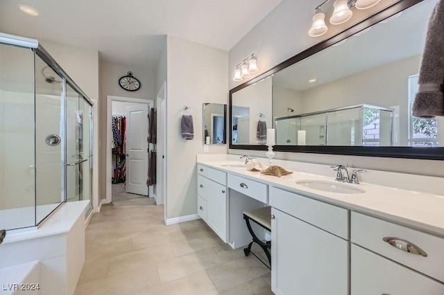 bathroom with vanity, tile patterned floors, and a shower with door