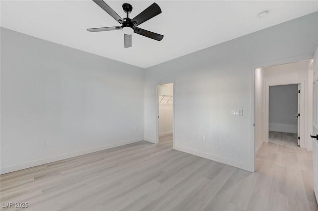 spare room featuring ceiling fan and light wood-type flooring