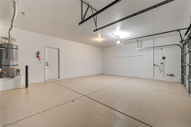 garage featuring secured water heater and a garage door opener